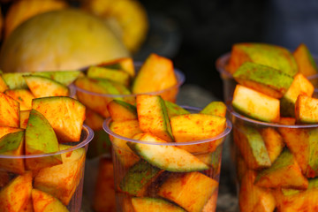 Sliced mangoes with mixed salt and chilly powder, tasty food items