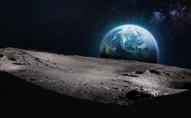 Moon surface with craters and Earth planet in deep space. Elements of this image furnished by NASA