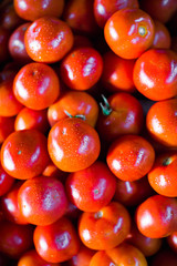 Fresh red tomato lying on the market counter. Red tomatoes texture, bright healthy vegetables and vegetatarian texture of red tomatos