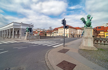 Naklejka premium Empty streets on Ljubljana's Dragon bridge on spring Sunday morning, usually packed with people, due to coronavirus quarantine, Ljubljana, Slovenia
