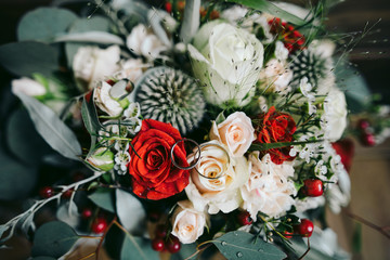 Engagement rings on a wedding bouquet