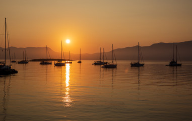 Naklejka na ściany i meble Beautiful seascape off the coast of Kastos island, Ionian sea, Greece in summer morning before sunrise.