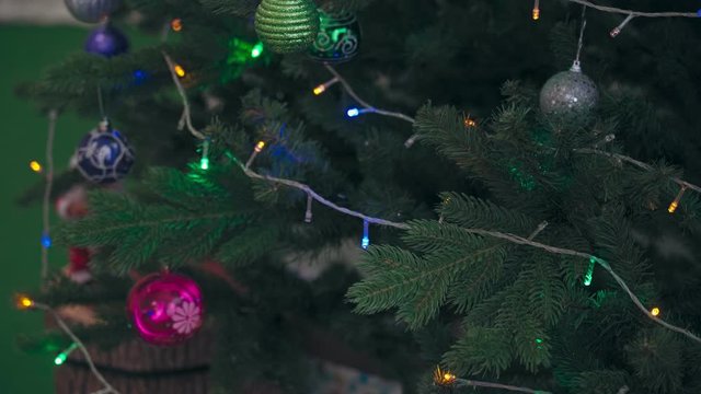 Beautiful Christmas tree with toys and garland close-up