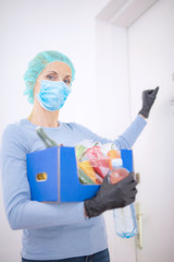 Fototapeta premium Home delivery food during virus outbreak, coronavirus panic and pandemics. Stay safe!