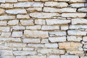 Old grunge brick wall background.fragment of an ancient stone wall.detail of ancient white brick wall, texture.