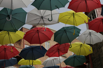 colorful umbrellas on a background of blue sky