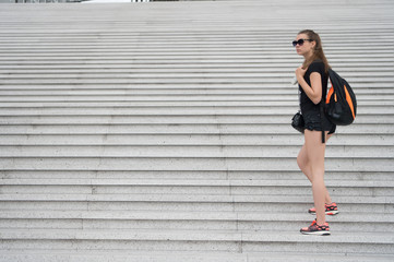 Come and see. Girl tourist stairs. Ready explore city. Woman sporty black outfit walking. Vacation and travel concept. Touristic guide sightseeing excursion. Vacation ideas. Vacation in big city