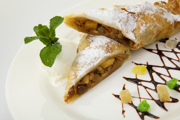 Strudel isolated on white background. Apple pie