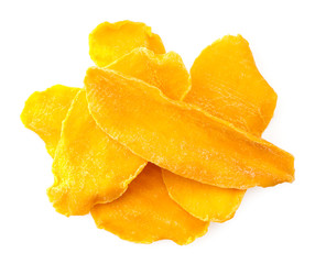 Dried mango slices close-up on a white. Top view
