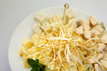 Assortment of cheese isolated on white background. Beer cheese plate