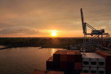 stationary containers ship at sunset time