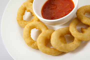 Appetizing Thick Cut Onion Rings isolated on white background