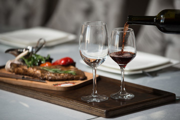 glass of red wine on a table