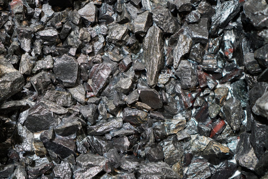 Close up view of the iron ore. rough Hematite, iron Kidney Ore stone. Pieces of ferrotitanium closeup. Close-up view of the iron stone