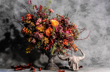 bouquet of flowers in vase on black background
