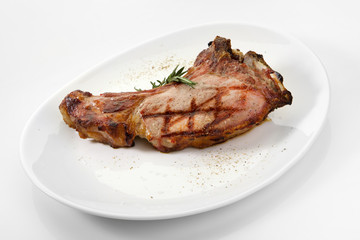 Appetizing grilled rib isolated on white background. Grilled mutton rib with blood