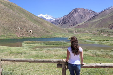 Fototapeta na wymiar Young woman enjoying the view of Aconcagua