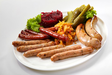 Assortment of sausages isolated on white background