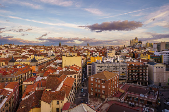 From above breathtaking landscape of city and bright houses roads under gray sky in Madrid, Spain