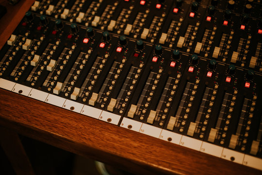 From above old vintage recording system in wooden frame with plastic button