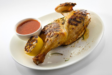 Roast chicken isolated on white background. Chicken tobacco. Grilled duck