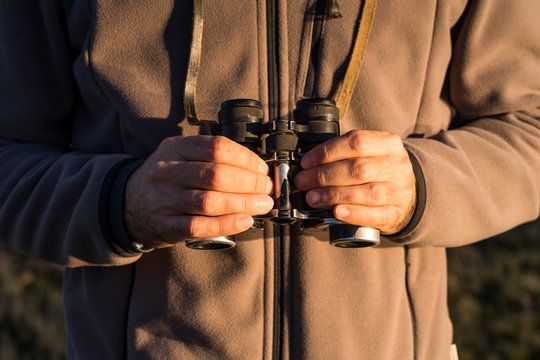 Cropped Unrecognizable Man Looking Through An Old Binoculars The Fauna Of A Lagoon In Spain