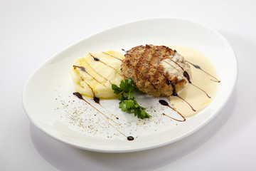 Appetizing chop (cutlet) with mashed potatoes isolated on white background. Grilled meat