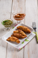 panzerotti filled with red pesto and basil pesto sauce