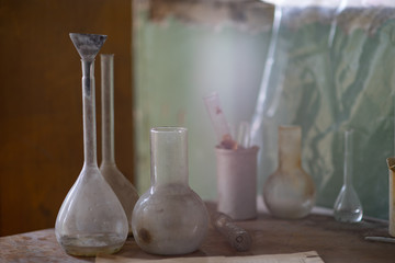Vintage equipment of chemical laboratory on wooden table