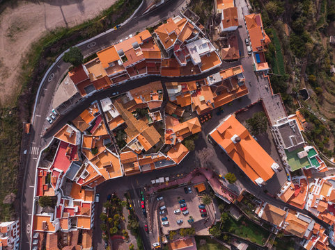 Aerial view of small town of Tejeda in valley of rocky mountains in sunlight, Gran Canaria
