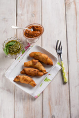 panzerotti filled with red pesto and basil pesto sauce