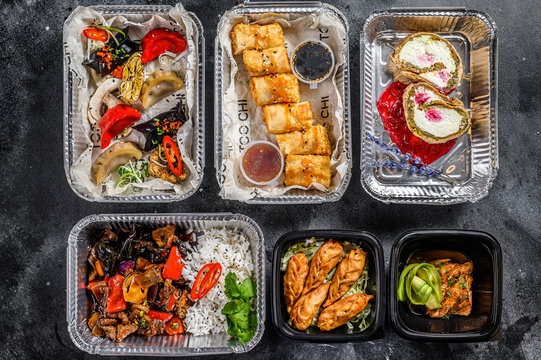 Choosing take away food. Spring rolls, dumplings, gyoza and dessert in lunch box. Take and go organic food. Thai and Asian traditional food. White background. Top view.