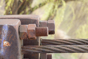 Rusty bolt mount, steel cable mount