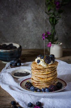 Tasty pancakes with blackberries and blueberries