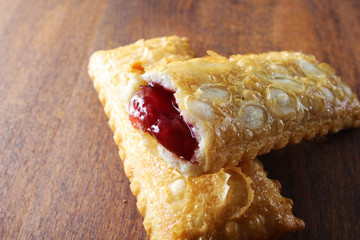 cherry pie Oil fried wild berries jam on a wooden background
