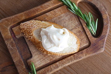 processed cheese bread on a wooden background