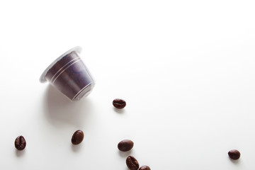 capsules of coffee on a white background