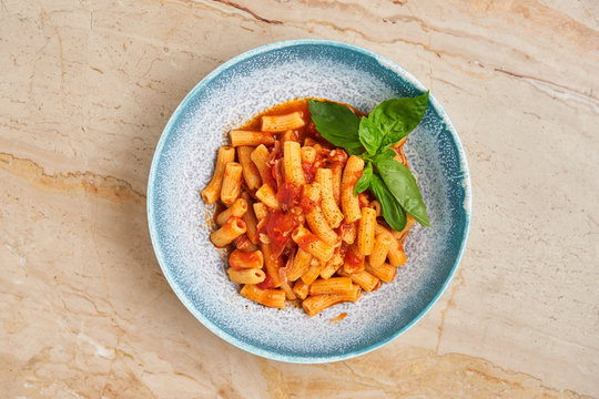 Tasty pasta with herbs and tomato