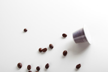 capsules of coffee on a white background