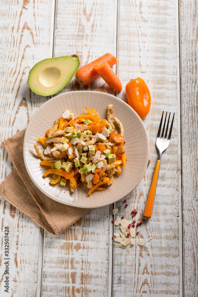 Poster chicken with avocado capsicum carrot and almond sliced