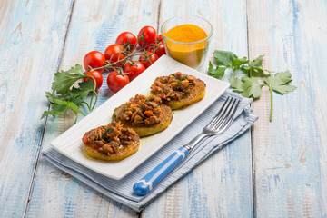 canapes with clam with tomatoes sauce and turmeric spice