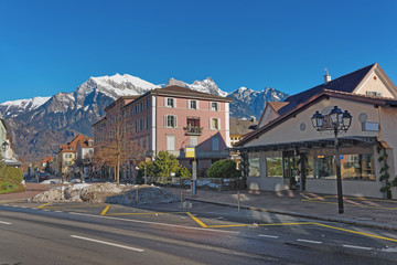 Fototapeta na wymiar Street view and the Alps in the Town of Bad Ragaz