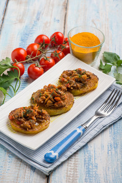 canapes with clam with tomatoes sauce and turmeric spice
