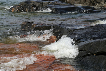 Waves hitting rocks in Helsinki, Finland. Beautiful photo representing the power and strength of...