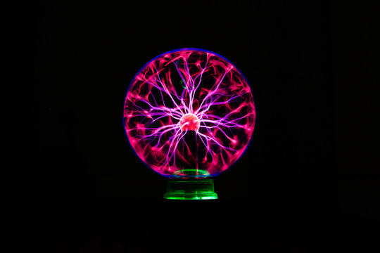 Light streams of light in luminous ball in dark