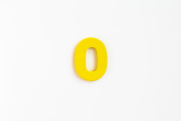 Fototapeta na wymiar yellow painted wooden number zero, craft sign for kid's education isolated, ecological concept