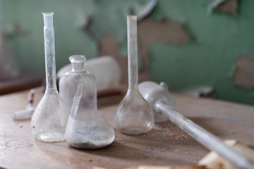Vintage equipment of chemical laboratory on wooden table