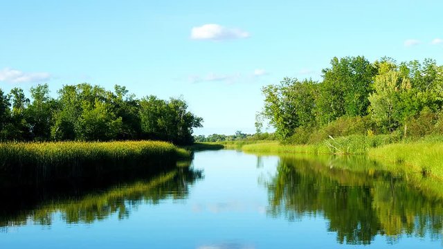 The beautiful Mississippi River near highway 2 in Bemidji, Minnesota in a clip from the POV of a moving boat. This scene is a few miles from the rivers source at Lake Itasca.