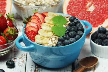 Healthy diet breakfast including cereal with berry and fruits