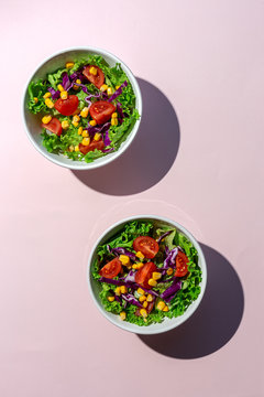 Overhead view of salad served in bowls on table